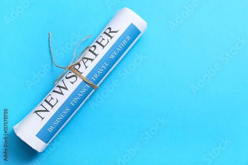 Modern newspaper on blue ba...