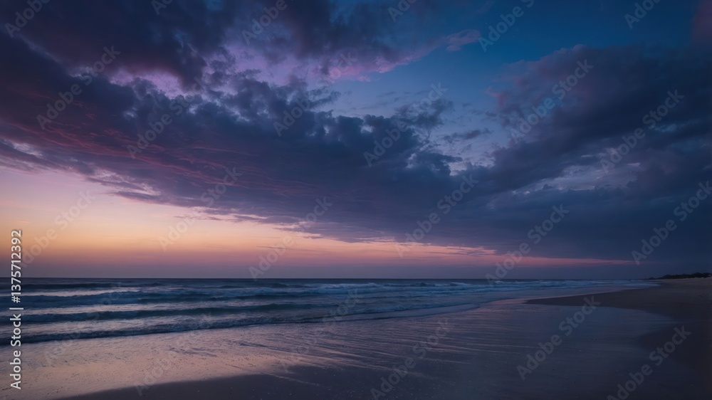 Fototapeta premium Ocean Beach at Dusk Waves Rolling Under a Colorful Sky