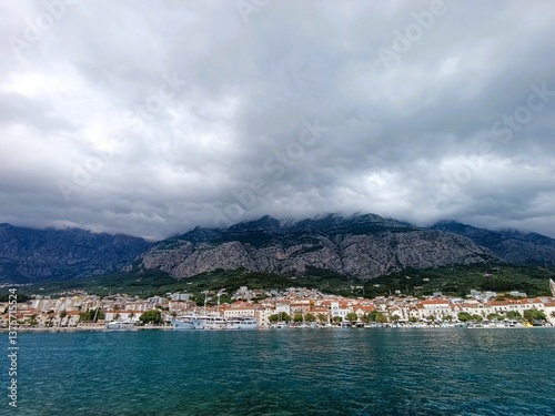 beautiful foggy view of Makarska town and the mountain Biokovo