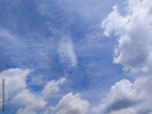 Bright Blue Sky with Moving White Clouds