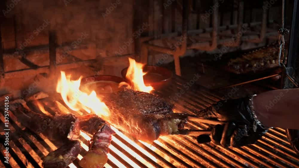 Chef expertly grilling ribeye steaks and pineapple slices over a fiery grill in a professional restaurant kitchen Chef expertly grilling ribeye steaks and pineapple slices over a fiery grill in a professional restaurant kitchen