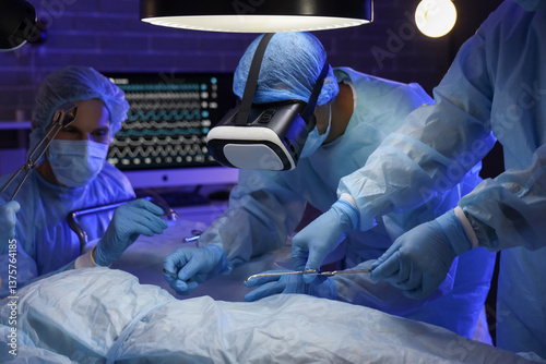 Surgeons with VR glasses op...