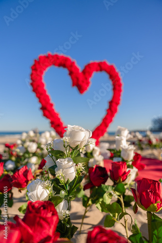 Romantic Beach Wedding Decoration with a Heart-Shaped Red Rose Arch