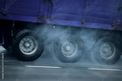 Heavy vehicles moving on wet roads