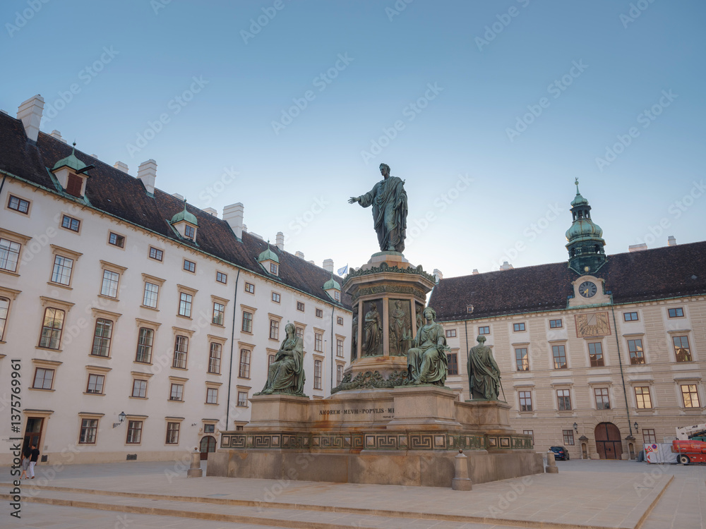 Fototapeta premium Summer trip to Vienna: exploring city beauty. Monument to Emperor Franz I at Hofburg Palace in Vienna, Austria in a beautiful summer day