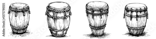 Various styles of drums displayed in a line for musical performance preparation in traditional cultural setting