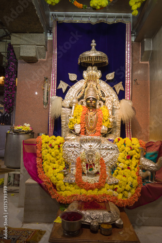 A divinely decorated Goddess Padmavati or Lakshmi made in pure silver metal during Ugadi and Mahavir Jayanti Jain festival in India.