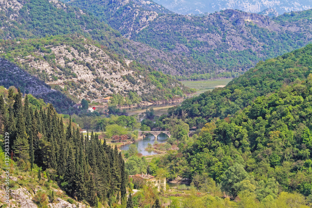 Aerial View of of Rijeka Crnojevica Village in Montenegro Green Landscape
