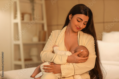 Woman breastfeeding her bab...