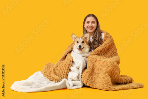 Young woman and Corgi dog w...