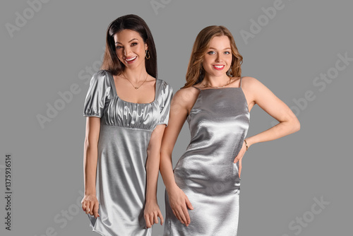 Stylish young women in silv...