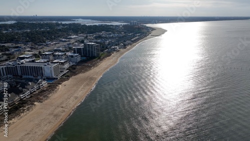 Wallpaper Mural Virginia Beach, VA coastline at sunset with sandy beach and resorts with beach house by calm peaceful water reflecting sunlight Torontodigital.ca