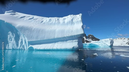 Iceberg scenery landscape scenery Arctic Antarctica beautiful nature winter tourism travel clear blue ice ocean sea water, Glacier melting ice ecology expedition concept. Greenland. Aerial drone view 