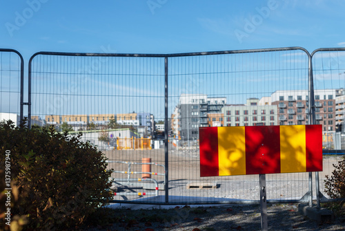 Barriers at roadside against sky in city photo