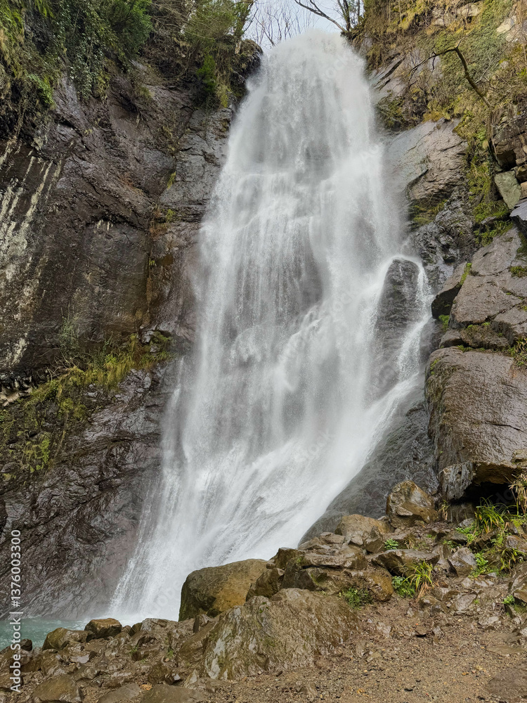 Majestic Waterfall Cascading Down Rocky Cliff
