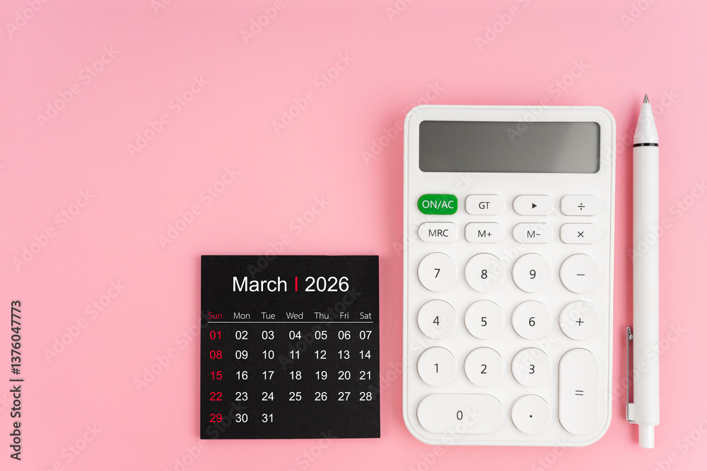 March 2026 calendar and white calculator with pen on pink background. March 2026 calendar and white calculator with pen on pink background.