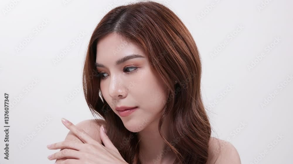 Smiling woman looking at skincare products on table Smiling woman looking at skincare products on table