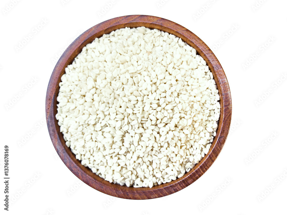 White sesame seeds in wooden bowl isolated on white background with clipping path. Healthy eating concept. Top view. Flat lay.