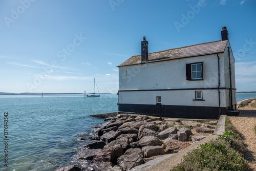 The Watch House at Lepe Hampshire England a former boathouse used by coastguard officers on the lookout for smugglers photo