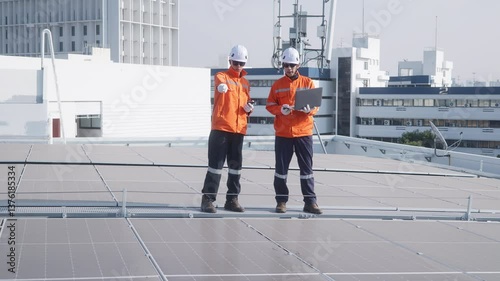 Wallpaper Mural Engineers inspecting solar panels on rooftop Torontodigital.ca
