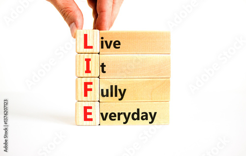 LIFE live it fully everyday symbol. Concept word LIFE Live It Fully Everyday on beautiful blocks. Beautiful white background. Business motivational LIFE live it fully everyday concept. Copy space.