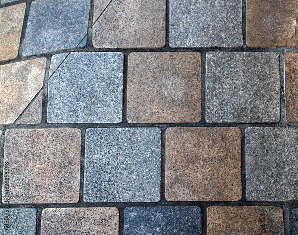 Obraz premium Stone Cube Roadway with Pastel Blue and Red Faded Tiles.