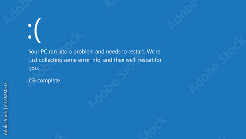 Blue screen error with sad face and restart message