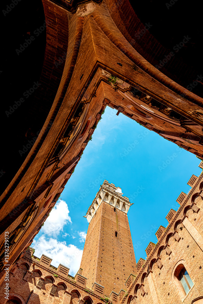 Fototapeta premium Courtyard of Palazzo Pubblico (town hall) with the Torre del Mangia in Siena historic center, Tuscany, Italy