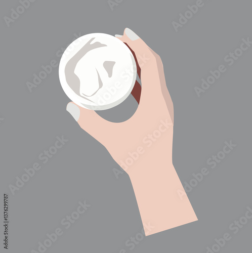 hand holding jar of body