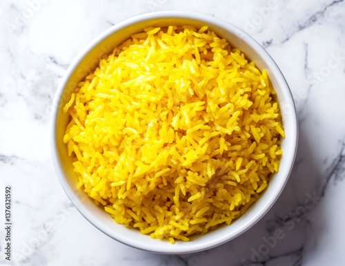 Serving of Yellow Rice in White Bowl on Marble Surface Overhead