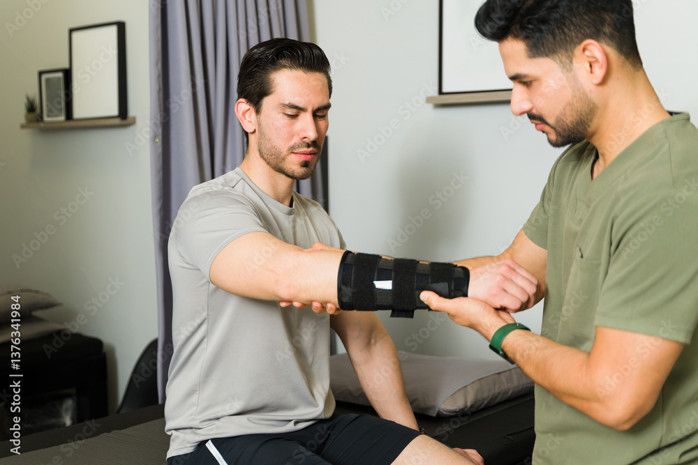 Professional physiotherapist fitting orthosis on patient's arm, supporting recovery and ensuring precise alignment during rehabilitation treatment