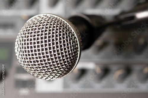 Canvas Print Dynamic microphone against the background of a musical synthesizer