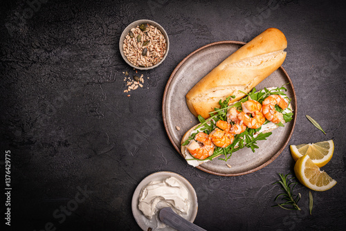 Healthy shrimp sandwiches for breakfast, snack, appetizers Toast with grilled prawns and whole grain bread with cream cheese and arugula on a dark background, top view
