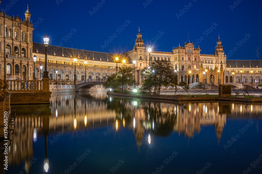 Fototapeta premium Long Exposure Scenery of Plaza de España in Seville. Beautiful Urban Architectural View of Famous Monument with Water Reflection in the Evening.