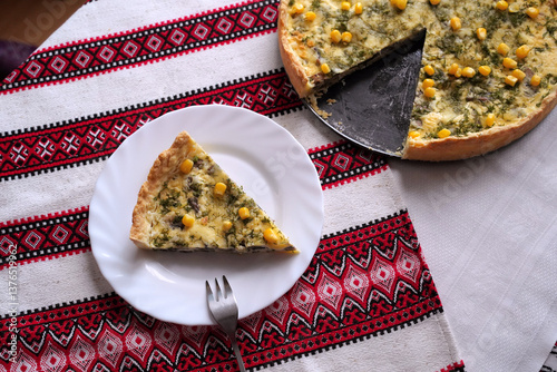 Obraz na płótnie Homemade quiche pie or tart. Food on the traditional Ukrainian table with embroidered tablecloth. w salonie