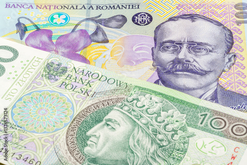 Wallpaper Mural 100 Romanian leu and 100 Polish zloty banknotes. International trade concept Torontodigital.ca