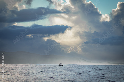 Obraz na płótnie Solitary Boat in the Ocean – Storm Clouds over Mauritius