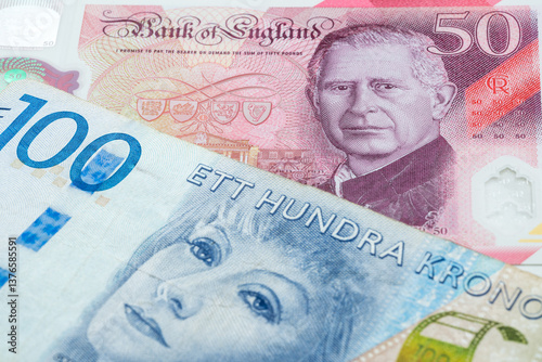 British 50 pounds and 100 Swedish krone banknotes. International trade concept
