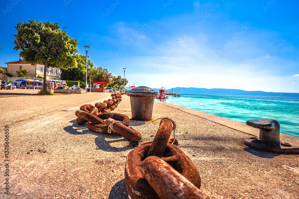 Croatia. Old rusty ship chain on Njivice waterfront view, maritime equipment symbol