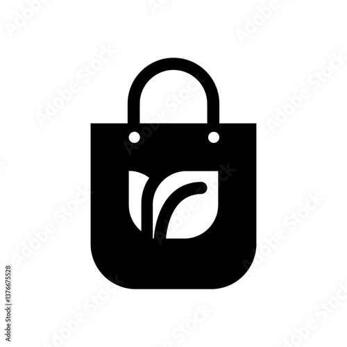 A black and white minimalist icon of a fabric shopping bag with a simple leaf symbol in the center. 