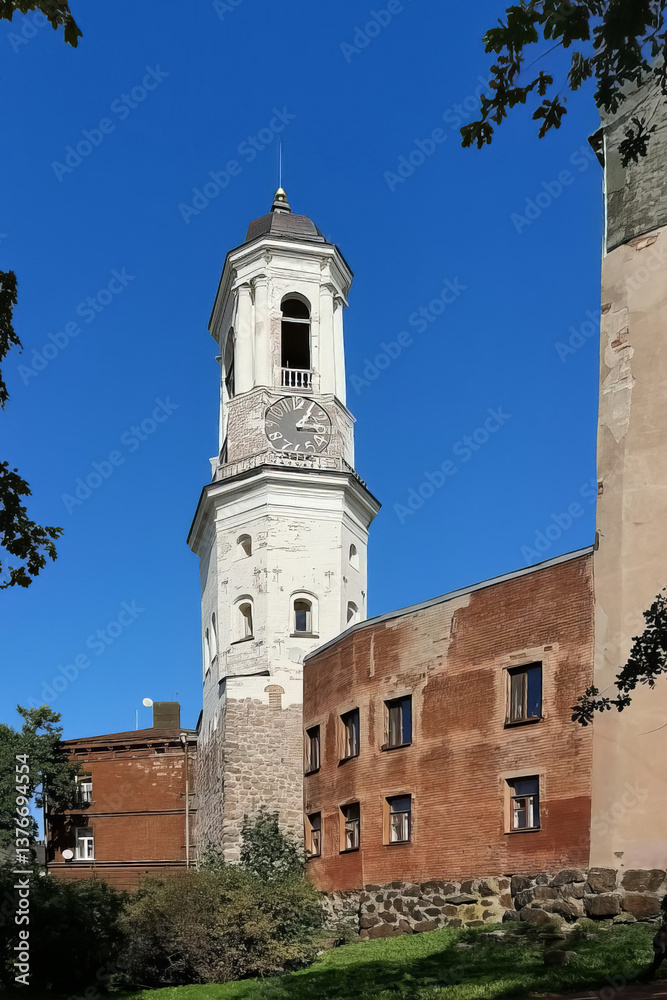 Obraz premium Vyborg, Russia - 08.25.24. Historic Clock Tower Against Blue Sky