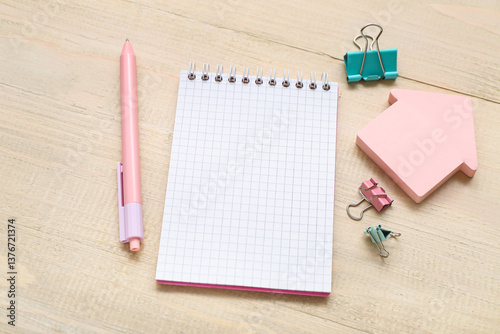 Pink pen and grid notebook ...