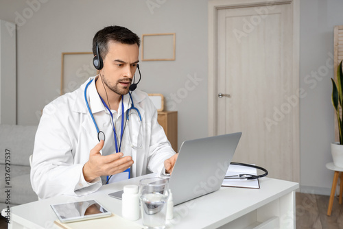 Handsome doctor in headset ...