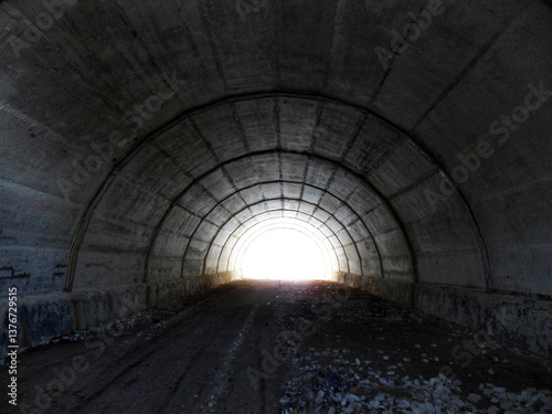 An abandoned old tunnel, a relic of past infrastructure, replaced by a new one