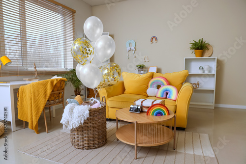 Basket with balloons and to...