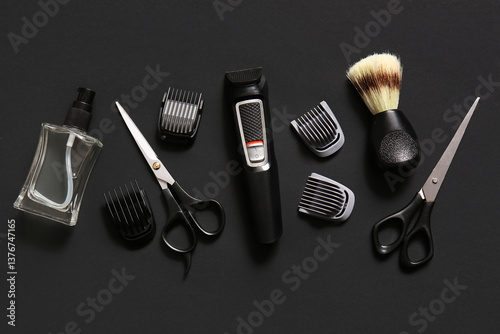 Electric trimmer and shaving accessories on black background