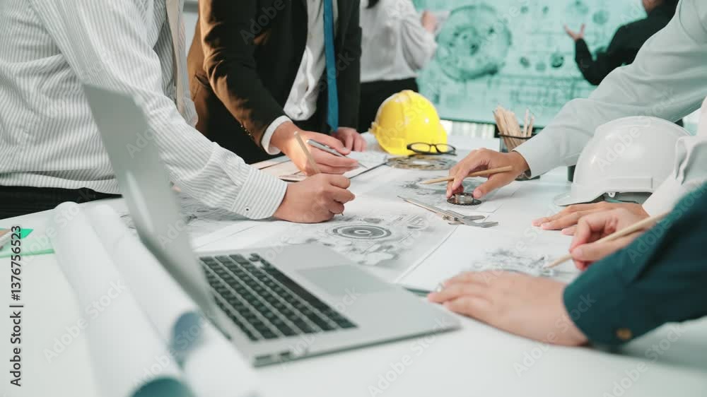 A diverse team engaged in a collaborative engineering project, focusing ...