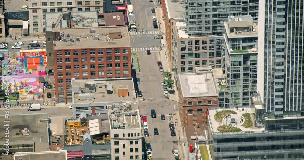 A Dynamic View Of Toronto Busy Streets In Summer, With Crowds Of People Walking And Crossing Intersections. The City Fast-Paced Lifestyle Is Captured In This Urban Scene. A Dynamic View Of Toronto Busy Streets In Summer, With Crowds Of People Walking And Crossing Intersections. The City Fast-Paced Lifestyle Is Captured In This Urban Scene.