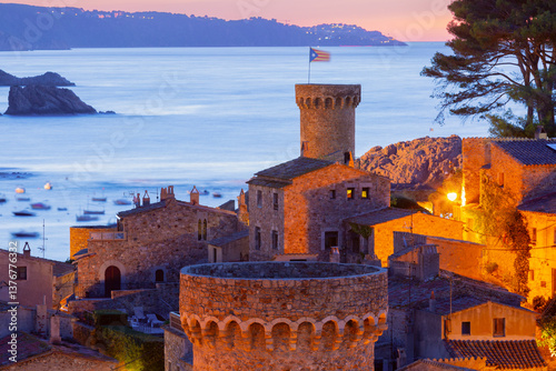 Obraz na płótnie Medieval stone towers and coastal village at sunrise in Tossa de Mar, Spain w salonie