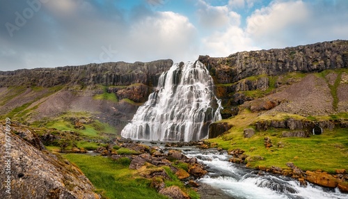 dynjandi is one the most famous waterfall of the west fjords of iceland at summer